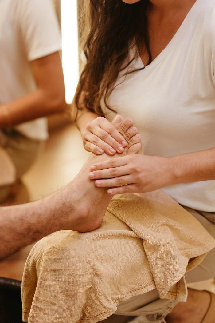 A relaxing foot massage session by a therapist, promoting wellness and pampering.